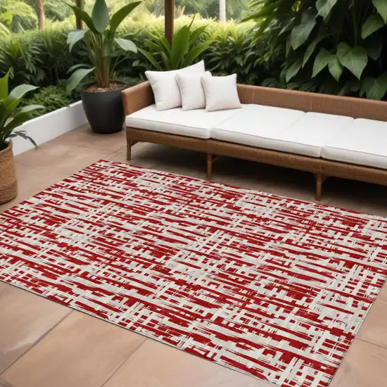 Red And Ivory Abstract Washable Indoor Outdoor Area Rug Photo 1