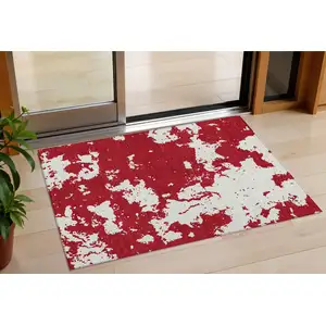 Photo of Red And Ivory Abstract Washable Indoor Outdoor Area Rug