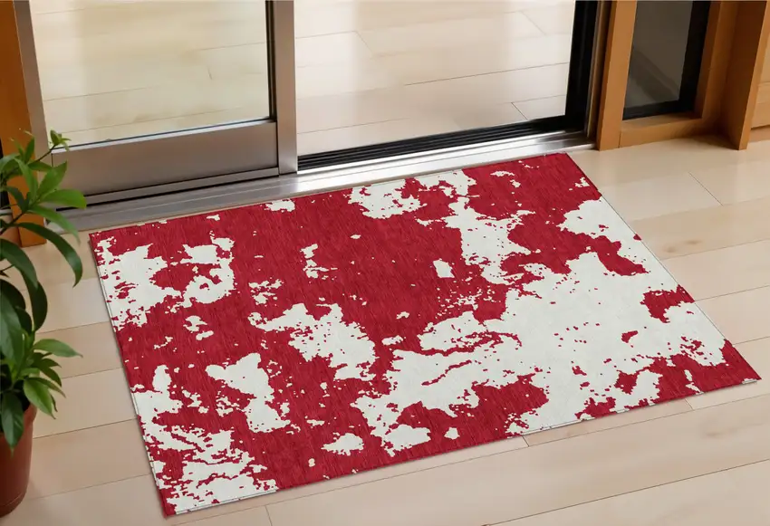 Red And Ivory Abstract Washable Indoor Outdoor Area Rug Photo 1