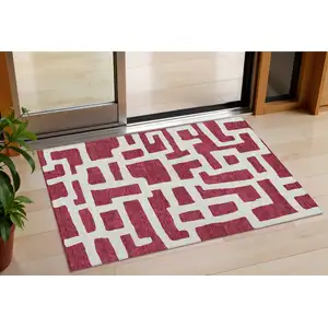 Photo of Red And Ivory Abstract Washable Indoor Outdoor Area Rug