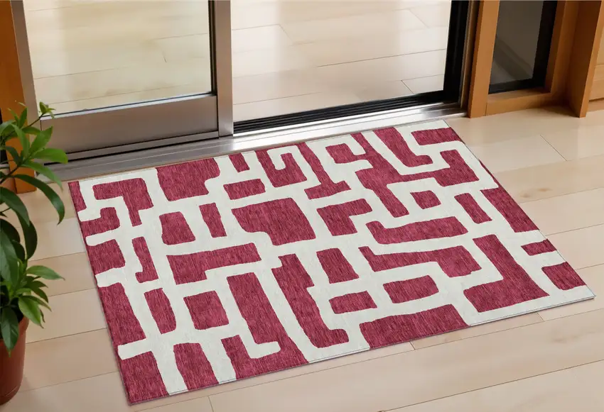 Red And Ivory Abstract Washable Indoor Outdoor Area Rug Photo 1