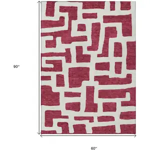 Photo of Red And Ivory Abstract Washable Indoor Outdoor Area Rug