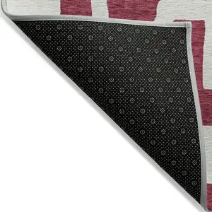 Photo of Red And Ivory Abstract Washable Indoor Outdoor Area Rug