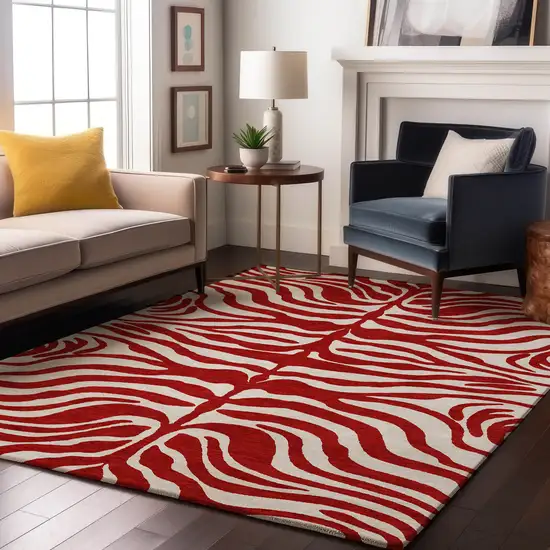 Red And Ivory Animal Print Washable Area Rug With UV Protection Photo 4