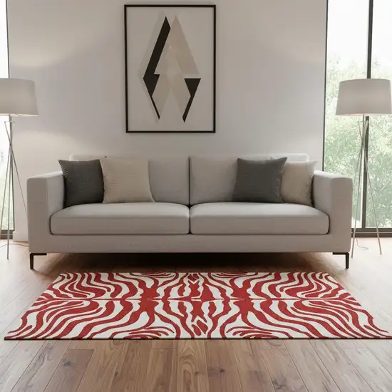 Red And Ivory Animal Print Washable Area Rug With UV Protection Photo 2