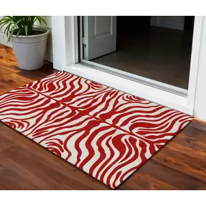 Photo of Red And Ivory Animal Print Washable Indoor Outdoor Area Rug