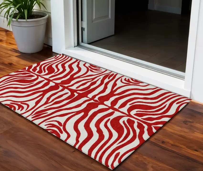 Red And Ivory Animal Print Washable Indoor Outdoor Area Rug Photo 1