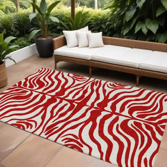Red And Ivory Animal Print Washable Indoor Outdoor Area Rug Photo 1