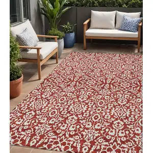 Photo of Red And Ivory Damask Washable Indoor Outdoor Area Rug
