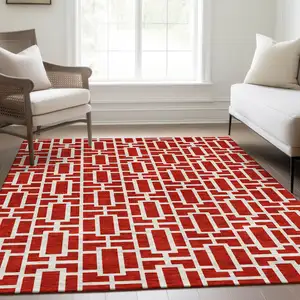 Photo of Red And Ivory Geometric Washable Area Rug With UV Protection