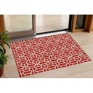 Photo of Red And Ivory Geometric Washable Indoor Outdoor Area Rug