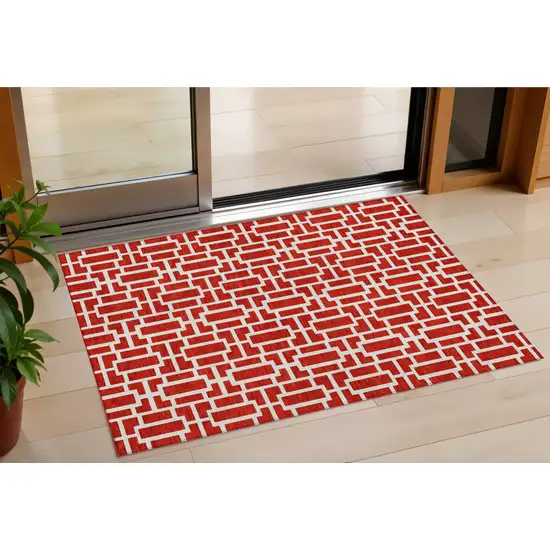 Red And Ivory Geometric Washable Indoor Outdoor Area Rug Photo 1