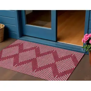Photo of Red And Ivory Geometric Washable Indoor Outdoor Area Rug