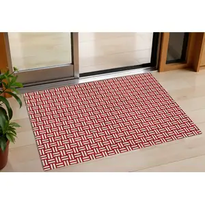 Photo of Red And Ivory Geometric Washable Indoor Outdoor Area Rug
