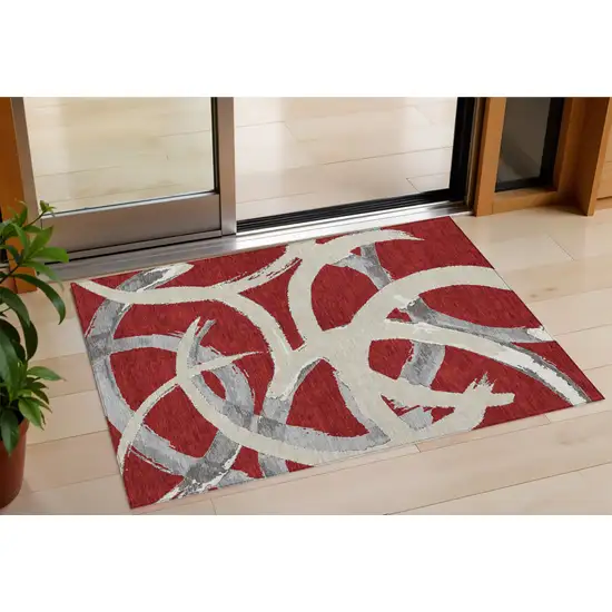 Red Beige And Gray Abstract Washable Indoor Outdoor Area Rug Photo 1