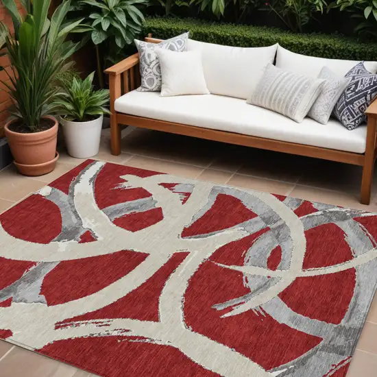 Red Beige And Gray Abstract Washable Indoor Outdoor Area Rug Photo 1