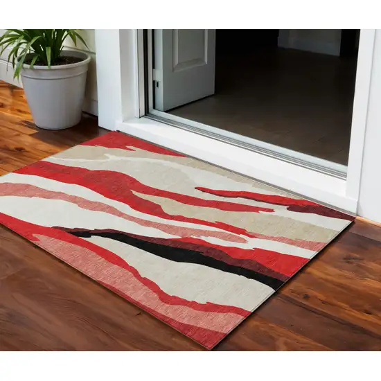 Red Black And Beige Abstract Washable Indoor Outdoor Area Rug Photo 1