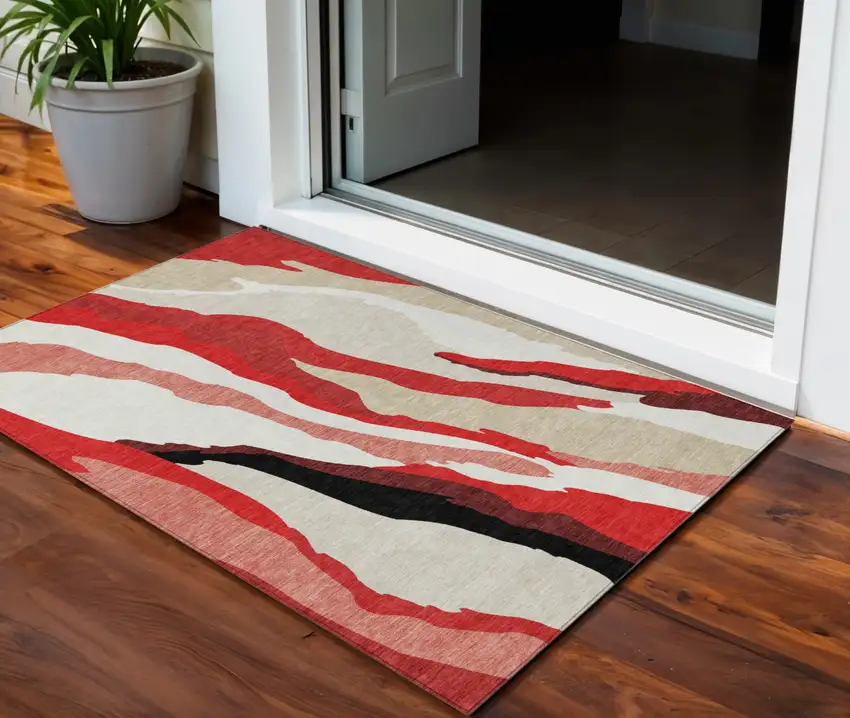 Red Black And Beige Abstract Washable Indoor Outdoor Area Rug Photo 1