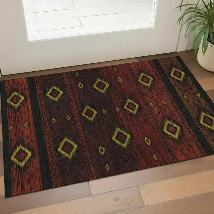 Red Black And Gold Tribal Washable Area Rug With UV Protection Photo 2