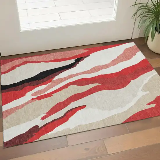 Red Black And Ivory Abstract Washable Area Rug With UV Protection Photo 1