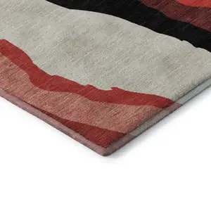 Photo of Red Black And Ivory Abstract Washable Area Rug With UV Protection