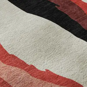 Photo of Red Black And Ivory Abstract Washable Area Rug With UV Protection