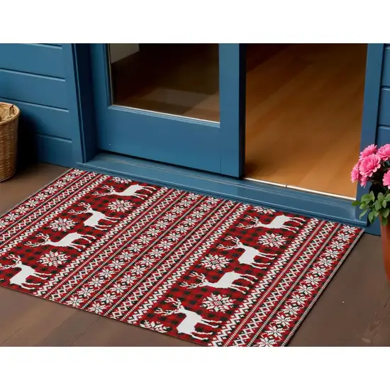 Red Black And Ivory Deer Washable Indoor Outdoor Area Rug Photo 1