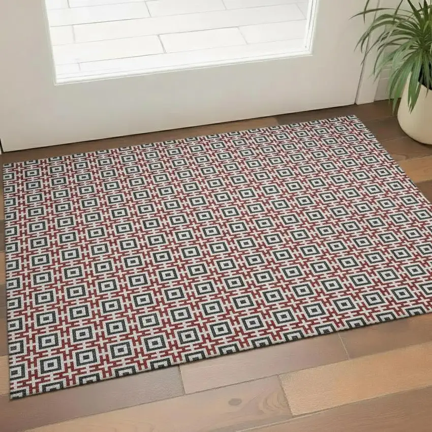 Red Black And Ivory Geometric Washable Area Rug With UV Protection Photo 1