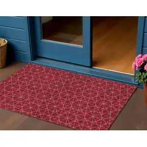 Photo of Red Black And Ivory Geometric Washable Indoor Outdoor Area Rug