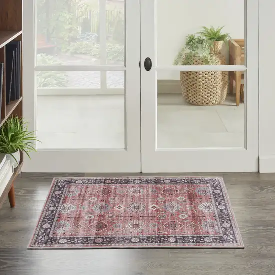 Red Black And Ivory Oriental Distressed Area Rug Photo 3