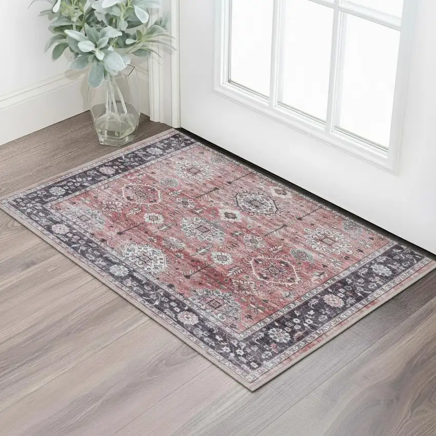 Red Black And Ivory Oriental Distressed Area Rug Photo 1