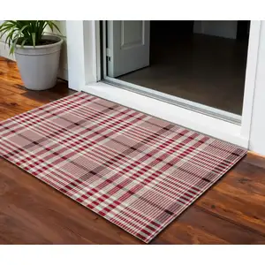 Photo of Red Black And Ivory Plaid Washable Indoor Outdoor Area Rug