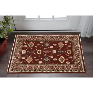 Photo of Red Black Ivory And Brown Oriental Power Loom Stain Resistant Area Rug With Fringe
