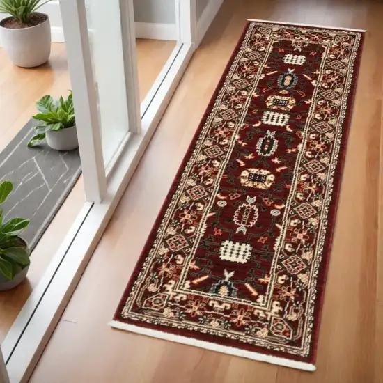 2' X 6' Red Black Ivory And Brown Oriental Power Loom Stain Resistant Runner Rug With Fringe Photo 1