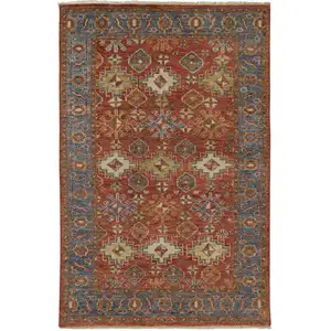 Photo of Red Blue And Orange Wool Floral Hand Knotted Stain Resistant Area Rug With Fringe