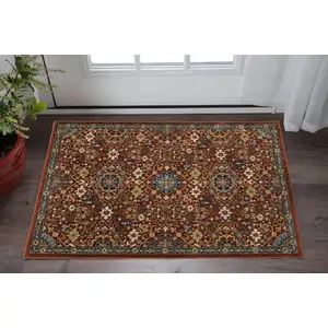 Photo of Red Blue Gold And Ivory Oriental Power Loom Stain Resistant Area Rug With Fringe