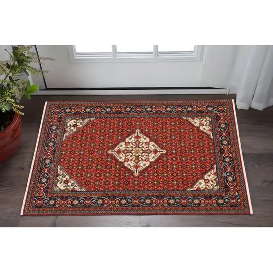 Red Blue Ivory And Orange Oriental Power Loom Stain Resistant Area Rug With Fringe Photo 1