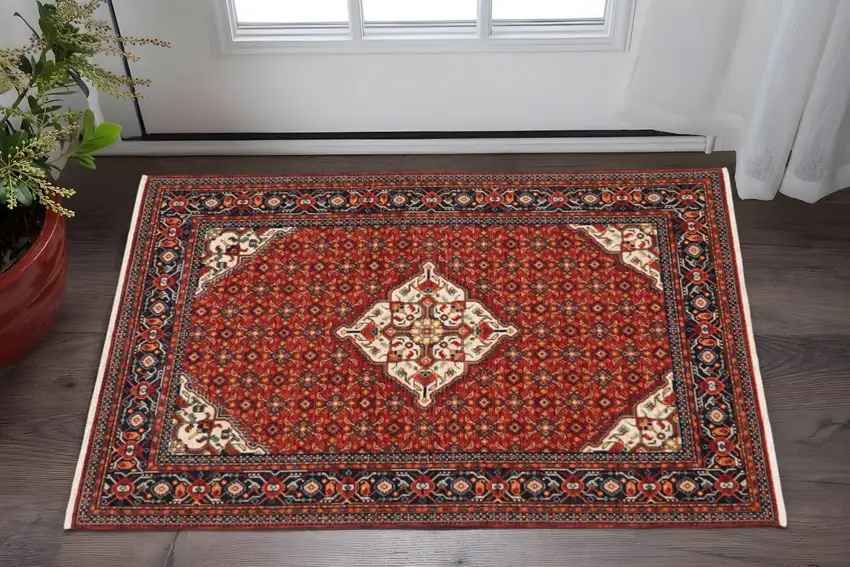 Red Blue Ivory And Orange Oriental Power Loom Stain Resistant Area Rug With Fringe Photo 1