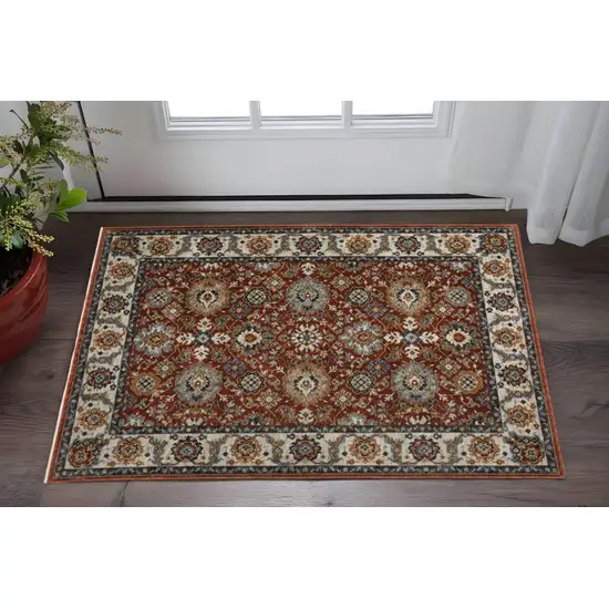 Red Blue Ivory Gold And Navy Oriental Power Loom Stain Resistant Area Rug With Fringe Photo 1