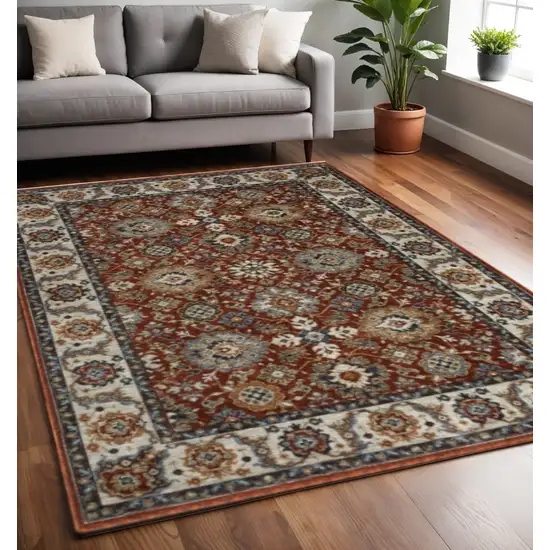 Red Blue Ivory Gold And Navy Oriental Power Loom Stain Resistant Area Rug With Fringe Photo 1