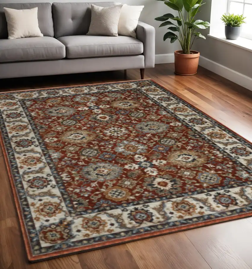 Red Blue Ivory Gold And Navy Oriental Power Loom Stain Resistant Area Rug With Fringe Photo 1