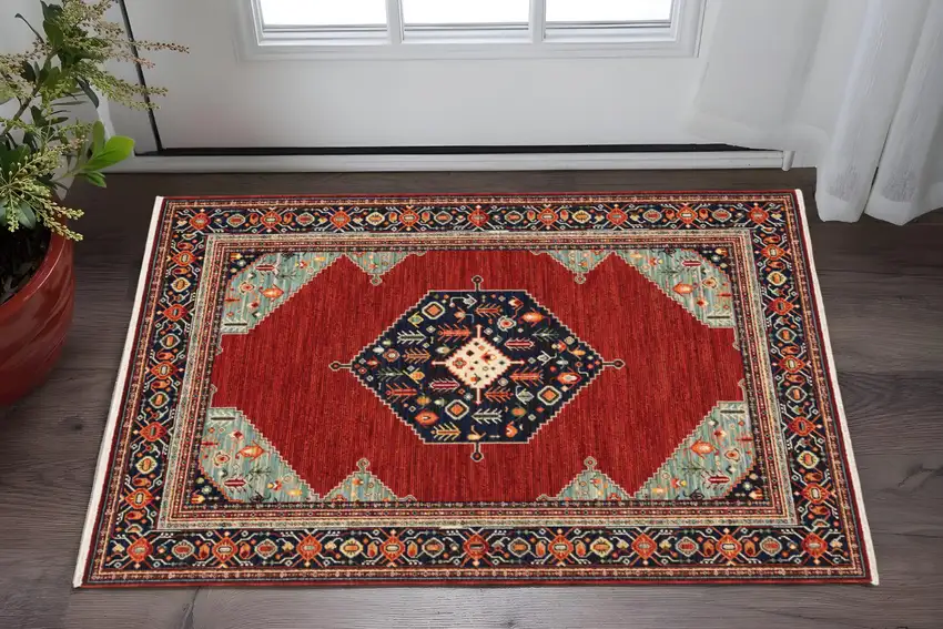Red Blue Orange And Ivory Oriental Power Loom Stain Resistant Area Rug With Fringe Photo 1