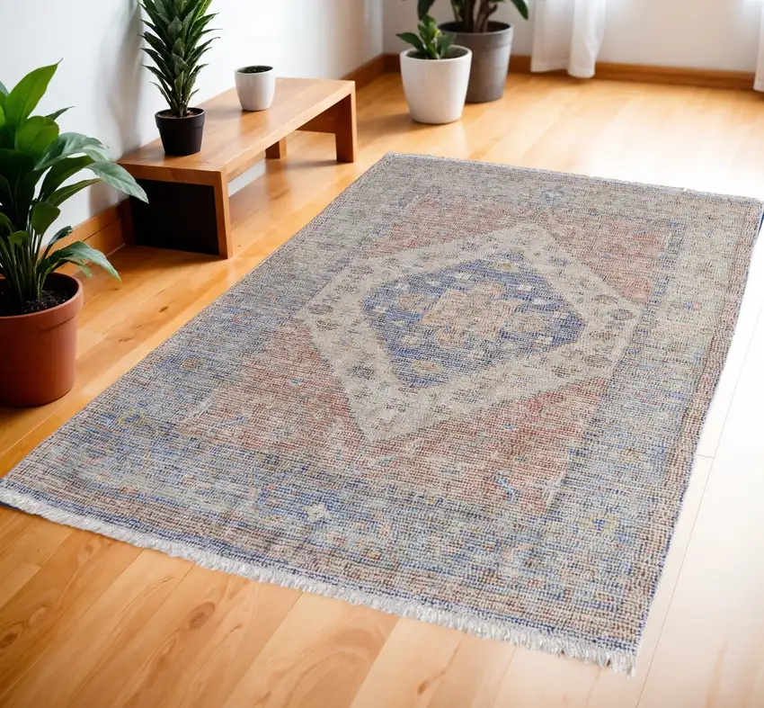 Red Blue and Ivory Abstract Hand Woven Distressed Area Rug With Fringe Photo 1