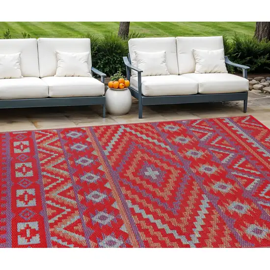 Red Geometric Machine Braided Distressed Area Rug With UV Protection Photo 1