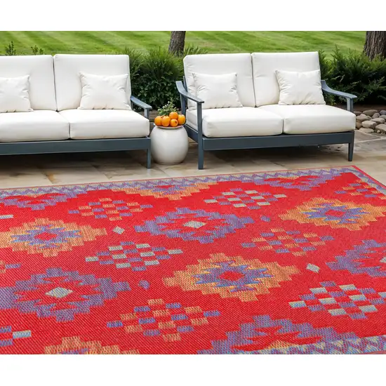Red Geometric Machine Braided Distressed Area Rug With UV Protection Photo 1