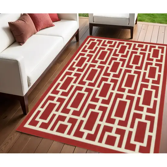 Red and Ivory Geometric Stain Resistant Indoor Outdoor Area Rug Photo 1