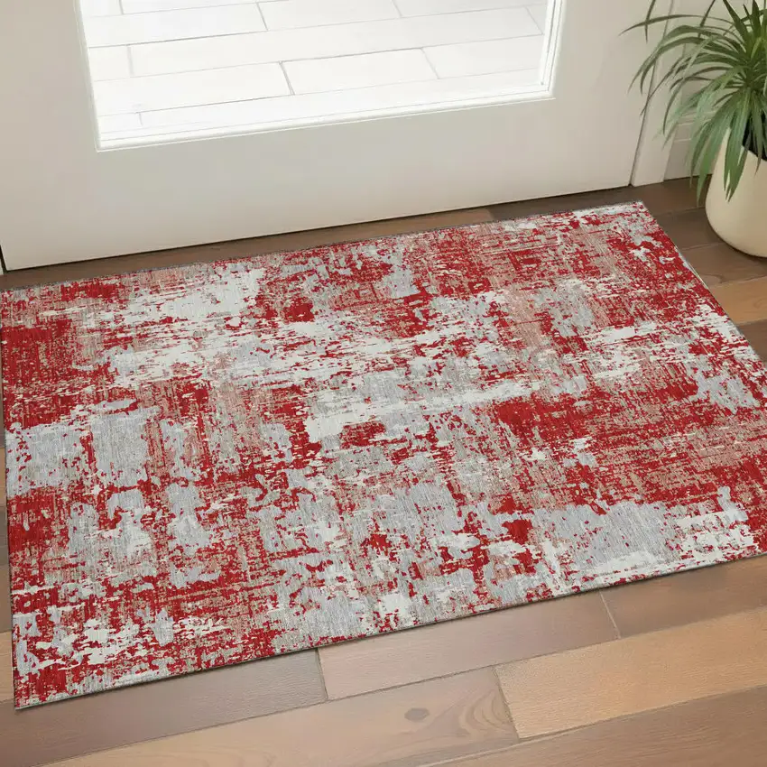 Red Gray And Ivory Abstract Washable Area Rug With UV Protection Photo 1