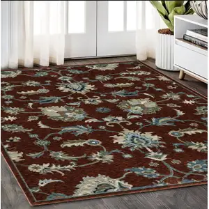 Photo of Red Ivory And Teal Oriental Area Rug With Fringe