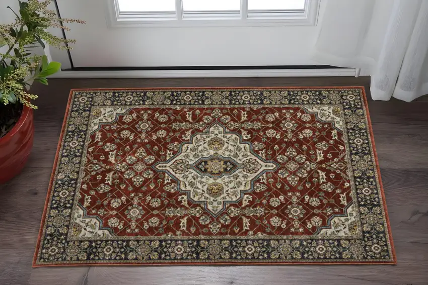 Red Ivory Blue Navy Gold And Grey Oriental Power Loom Stain Resistant Area Rug With Fringe Photo 1