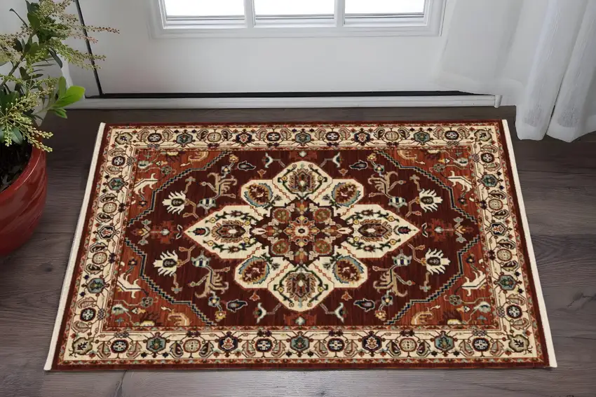 Red Ivory Orange And Blue Oriental Power Loom Stain Resistant Area Rug With Fringe Photo 1